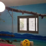טפט נדנדה בים לסלון | StickDecor